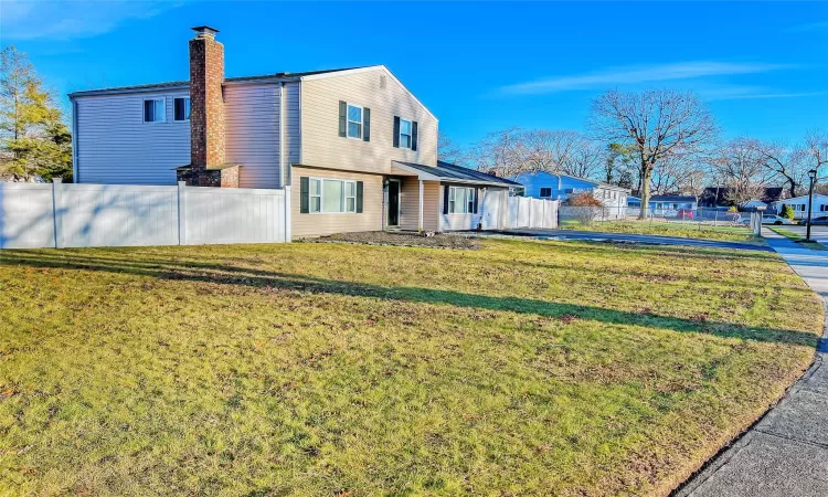 View of yard featuring a fenced in pool and central air condition unit