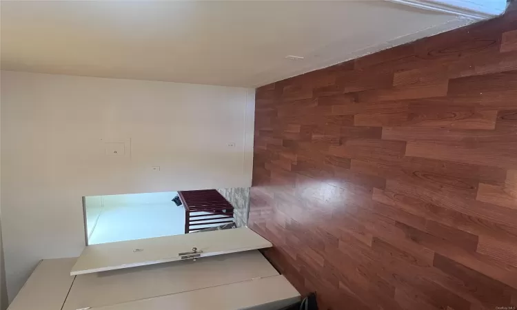 Unfurnished room featuring dark hardwood / wood-style flooring