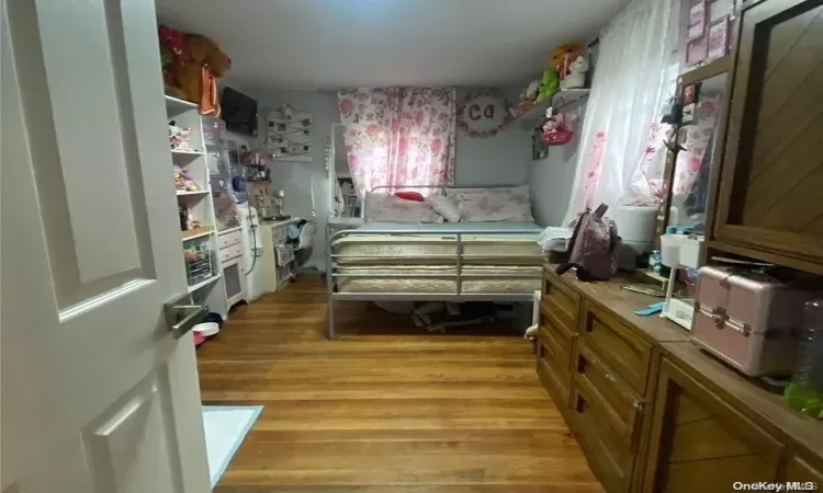 Bedroom featuring hardwood / wood-style flooring