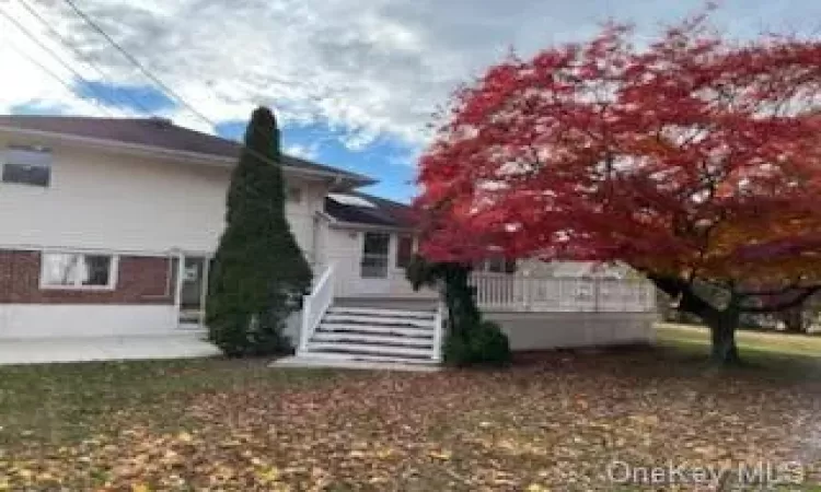 View of home's exterior with a yard