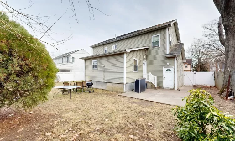 Rear view of house with a patio area