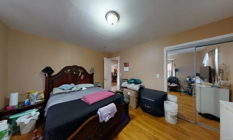 Bedroom with a closet and light wood-type flooring