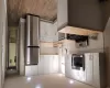 Kitchen featuring butcher block countertops, stove, white cabinets, and fridge