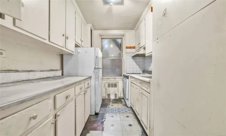 Spare room with wood-type flooring and radiator