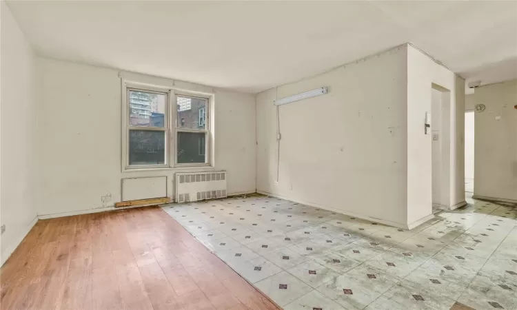 Empty room featuring light hardwood / wood-style flooring