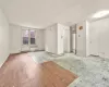 Unfurnished room with light wood-type flooring and radiator