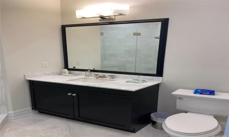 Bathroom with vanity and walk in shower