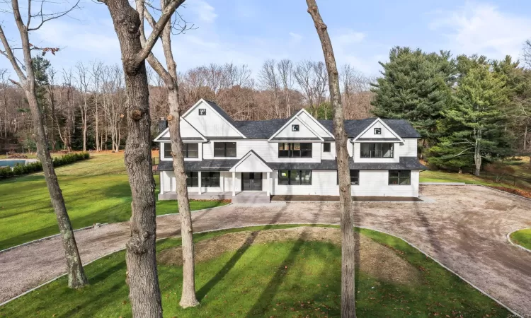 View of front of house featuring a front yard and a porch