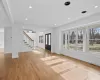 Unfurnished living room with french doors and light hardwood / wood-style flooring