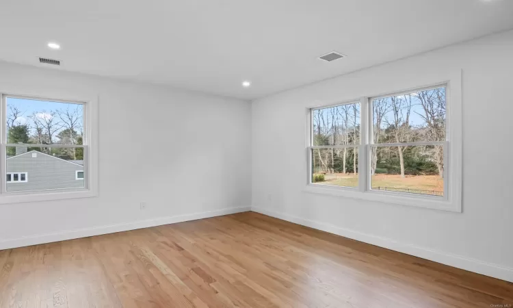 Spare room with light hardwood / wood-style floors