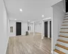 Basement with light hardwood / wood-style flooring