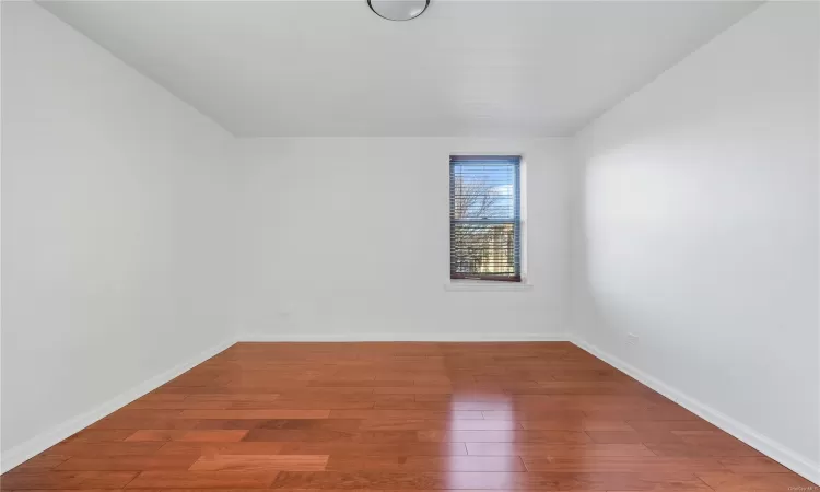 Spare room with hardwood / wood-style floors