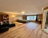 Bedroom featuring hardwood / wood-style floors, a textured ceiling, and ornamental molding