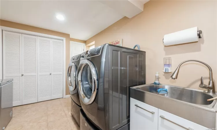 Laundry with storage closet, sink