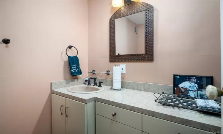 Bathroom featuring shower / bathtub combination with curtain, tile walls, and toilet