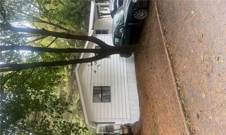 View of side of home with a carport