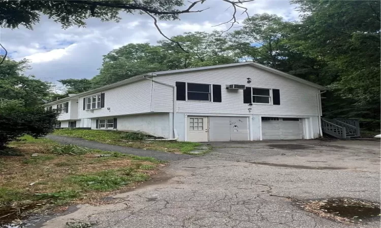 View of side of home with a garage