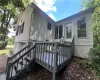 Rear view of property with a wooden deck