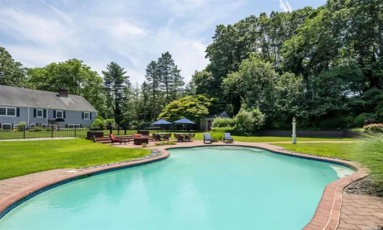 Gunite pool with brick surround.