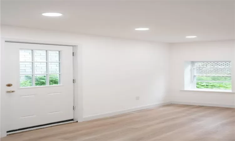 Entryway with light hardwood / wood-style floors