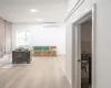 Empty room featuring hardwood / wood-style floors and a wall mounted air conditioner