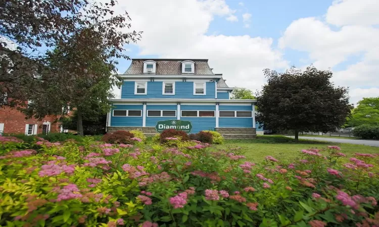 View of front of house with a front lawn