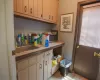 Bathroom featuring tile floors, plenty of natural light, and sink