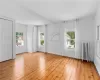 Spare room featuring light wood-type flooring and radiator