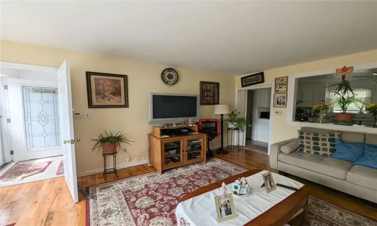 Living room with hardwood / wood-style floors