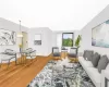 Living room featuring hardwood / wood-style flooring and a chandelier