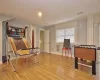 Recreation room featuring light wood-type flooring