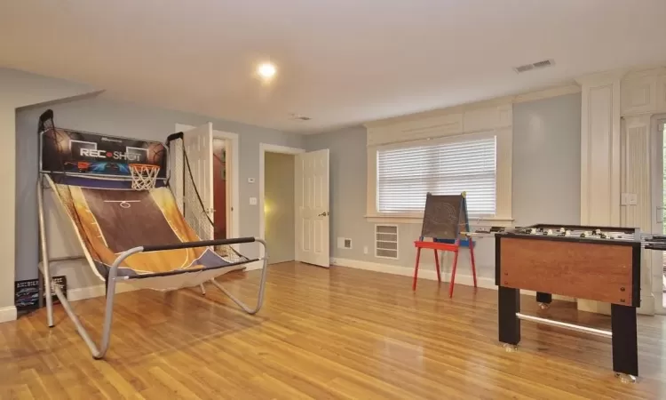 Recreation room featuring light wood-type flooring