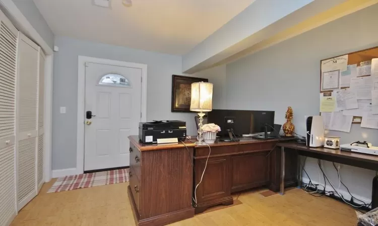 Office space with light wood-type flooring