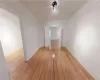 Empty room with light hardwood / wood-style floors