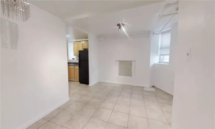 Tiled empty room with sink