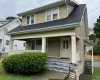 View of front of house with covered porch