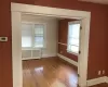 Spare room with radiator heating unit and hardwood / wood-style floors