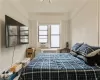 Bedroom with cooling unit and crown molding