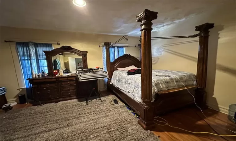 Bedroom featuring wood-type flooring