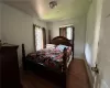 Bedroom 2 with dark wood-type flooring