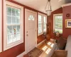 Entryway featuring vaulted ceiling and light hardwood / wood-style floors