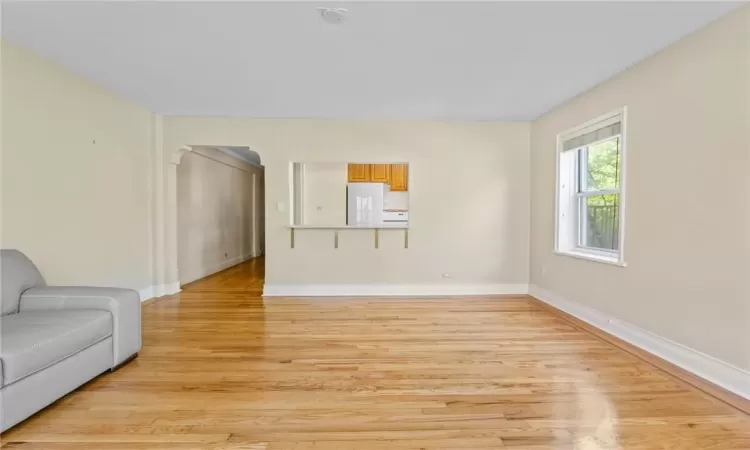 Unfurnished living room featuring light hardwood / wood-style floors