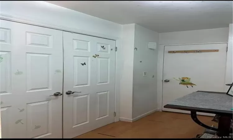 Foyer entrance with light wood-type flooring