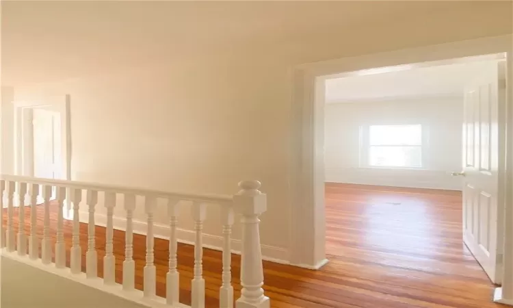 Corridor featuring light hardwood / wood-style flooring