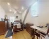 Bedroom 3 unit 2 featuring light wood flooring, a wall unit AC, and ceiling fan