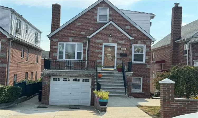 View of front facade featuring a garage