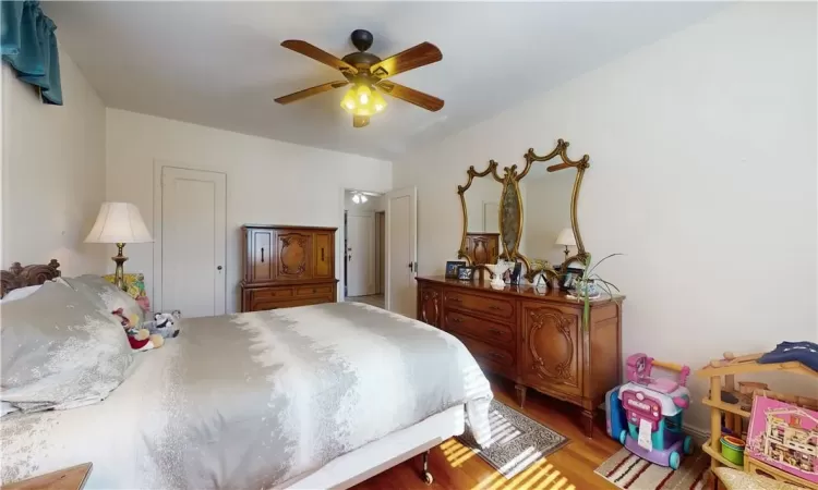 Bedroom 1 unit 2 featuring light wood-type flooring and ceiling fan