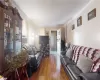 Living room unit 1 with hardwood flooring and crown molding