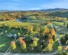 Drone / aerial view featuring a mountain view and a rural view