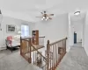 Hallway featuring light colored carpet and baseboard heating